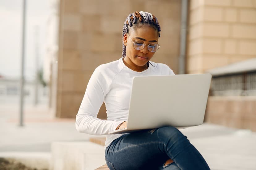 A girl sitting with her laptop