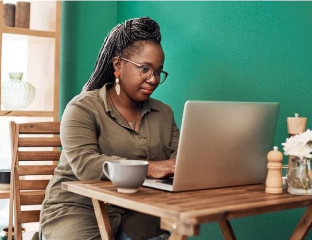 A woman working on a laptop