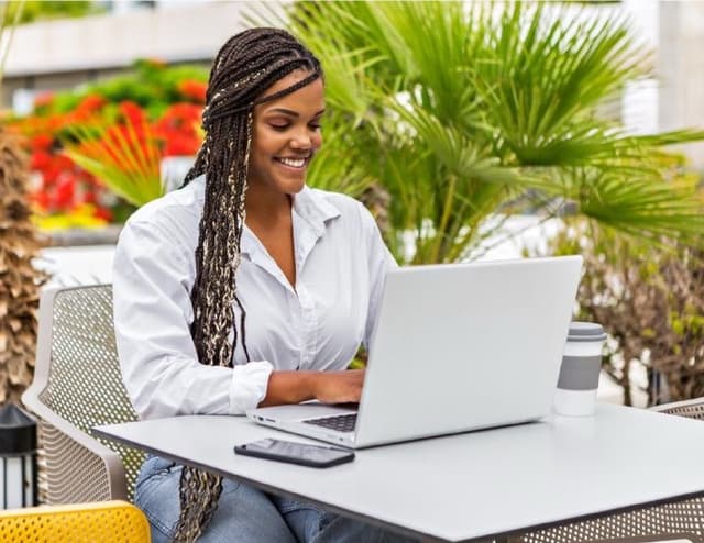 A woman working on a laptop